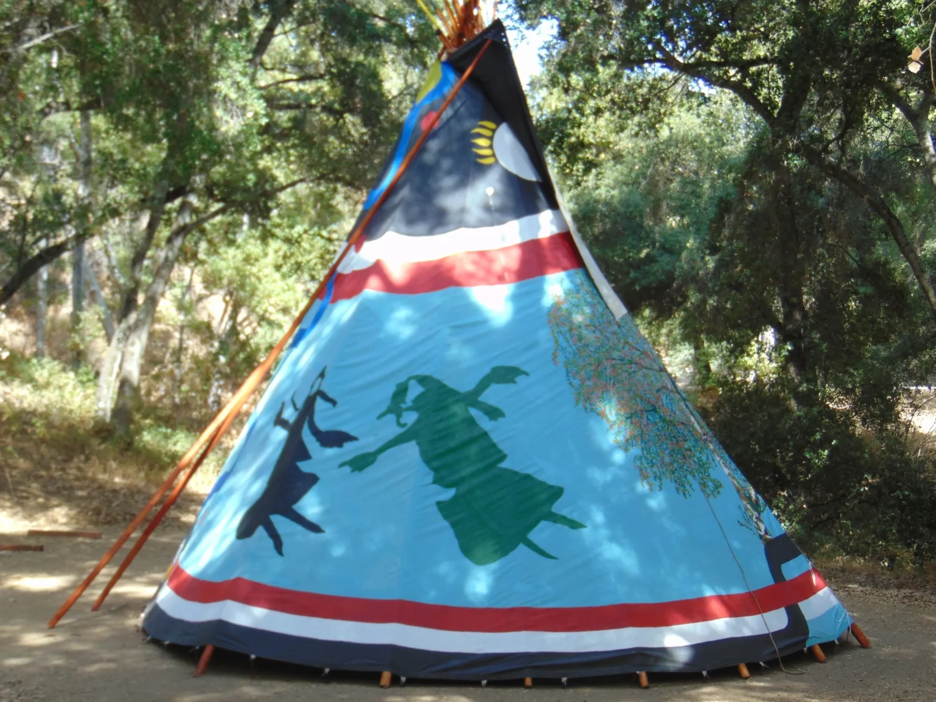 A teepee with an image of a man and woman.